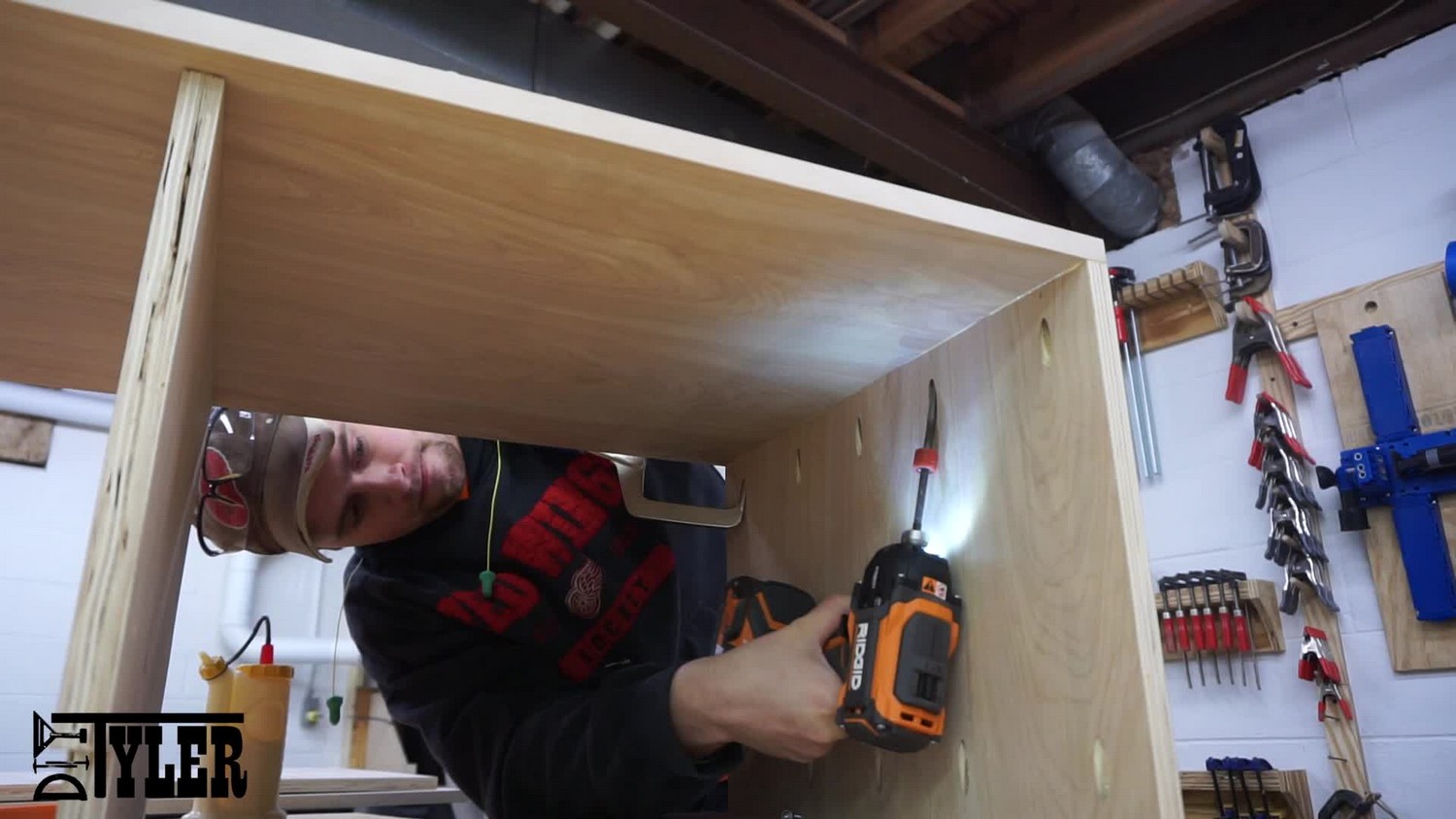 Putting the cabinet side in place