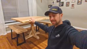 man demonstrating pedestal game table